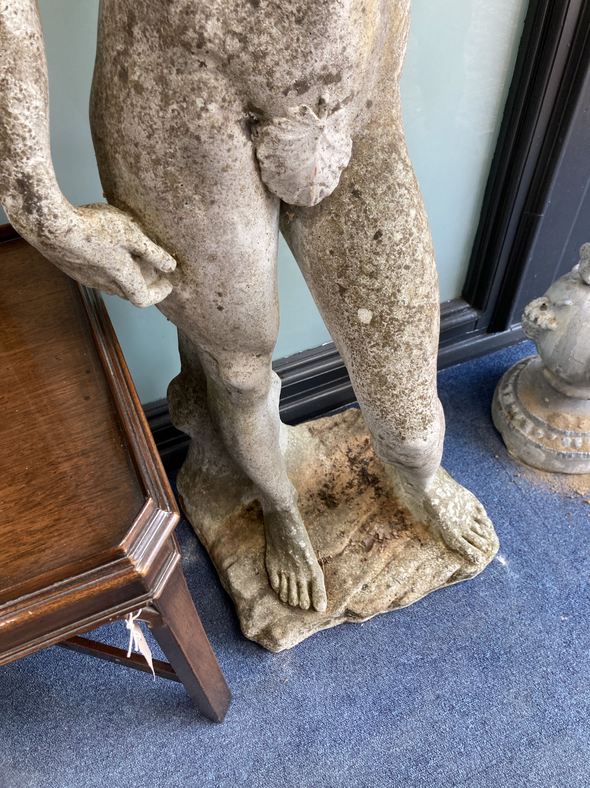 A reconstituted stone garden ornament of David, height 130cm
